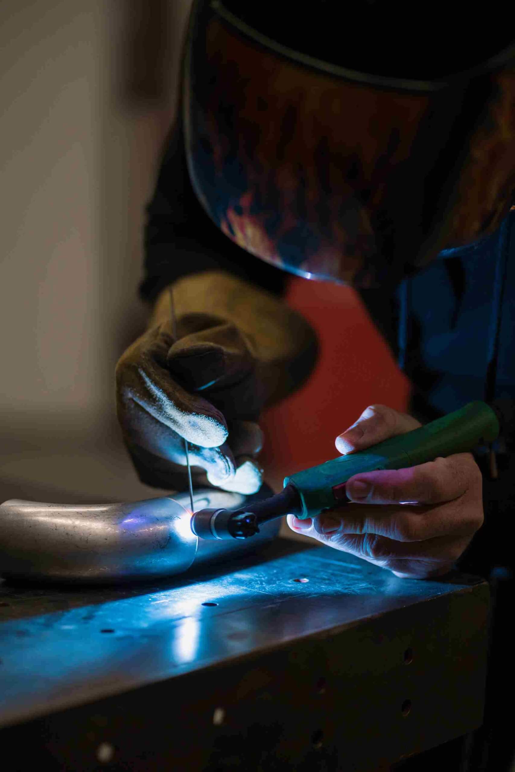 man-working-with-argon-welding-machine-garage (1)